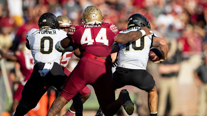 Florida State Seminoles defensive tackle Joshua Farmer (44) sacks Wake Forest Demon Deacons