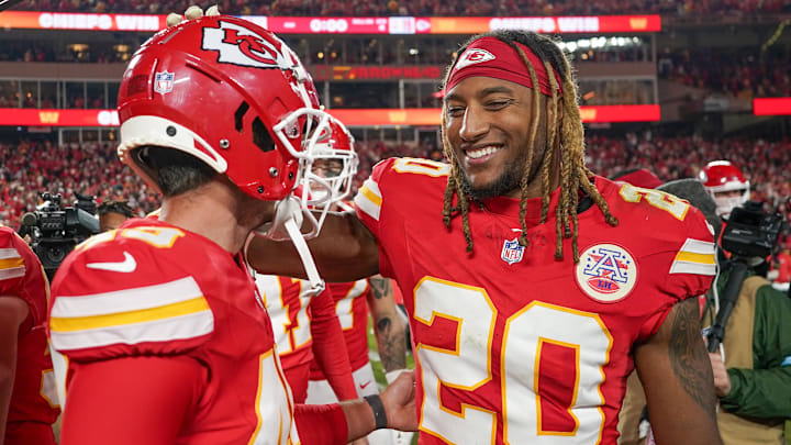 Dec 8, 2024; Kansas City, Missouri, USA; Kansas City Chiefs place kicker Matthew Wright (49) celebrates with safety Justin Reid (20) after the win over the Los Angeles Chargers at GEHA Field at Arrowhead Stadium. Mandatory Credit: Denny Medley-Imagn Images
