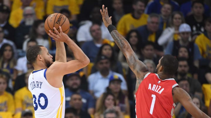 May 26, 2018; Oakland, CA, USA; Golden State Warriors guard Stephen Curry (30) shoots the ball against Houston Rockets forward Trevor Ariza (1) during the second quarter in game six of the Western conference finals of the 2018 NBA Playoffs at Oracle Arena. Mandatory Credit: Kyle Terada-USA TODAY Sports