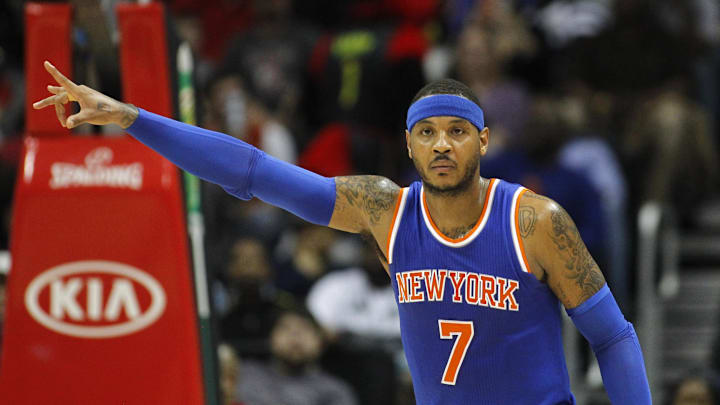New York Knicks forward Carmelo Anthony gestures from the court against the Atlanta Hawks. New York Knicks forward Carmelo Anthony gestures from the court against the Atlanta Hawks.
