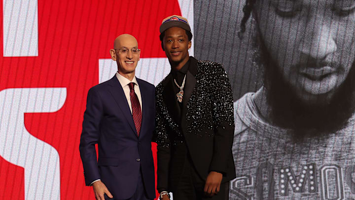 Jun 26, 2024; Brooklyn, NY, USA; Ron Holland II poses for photos with NBA commissioner Adam Silver after being selected in the first round by the Detroit Pistons in the 2024 NBA Draft at Barclays Center. Mandatory Credit: Brad Penner-Imagn Images