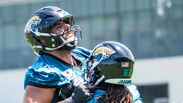 Jacksonville Jaguars guard Patrick Mekari (65) and Jacksonville Jaguars offensive tackle Javon Foster (62) run blocking drills during the fourth organized team activity at the Miller Electric Center in Jacksonville, Fla. Tuesday, May 27, 2025. [Doug Engle/Florida Times-Union]