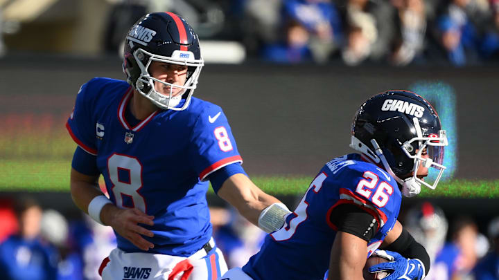 Dec 4, 2022; East Rutherford, New Jersey, USA; New York Giants quarterback Daniel Jones (8) hands
