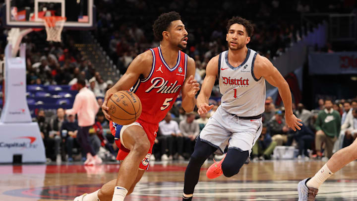 Apr 9, 2025; Washington, District of Columbia, USA; Philadelphia 76ers guard Quentin Grimes (5) drives to the basket as Washington Wizards guard Colby Jones (1) depends in the first half at Capital One Arena. Mandatory Credit: Geoff Burke-Imagn Images