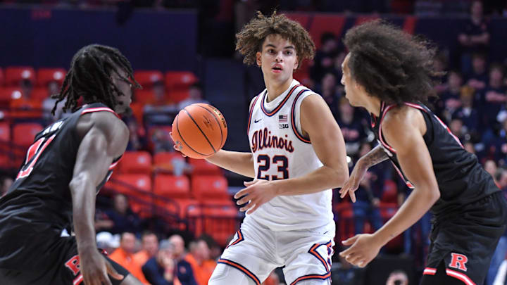 Jan 8, 2026; Champaign, Illinois, USA;  Illinois Fighting Illini guard Keaton Wagler (23) looks to pass between Rutgers Scarlet Knights players during the first half at State Farm Center. Mandatory Credit: Ron Johnson-Imagn Images