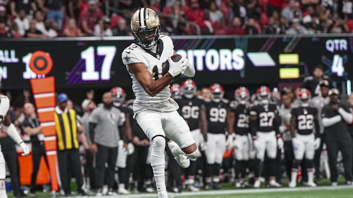 Sep 29, 2024; Atlanta, Georgia, USA; New Orleans Saints wide receiver Chris Olave (12) catches a pass against the Atlanta Falcons during the fourth quarter at Mercedes-Benz Stadium. Mandatory Credit: Dale Zanine-Imagn Images