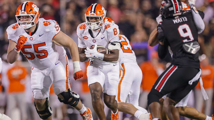 OL Harris Sewell (55) leads the way for RB Adam Randall (8) in  Clemson v Louisville game 