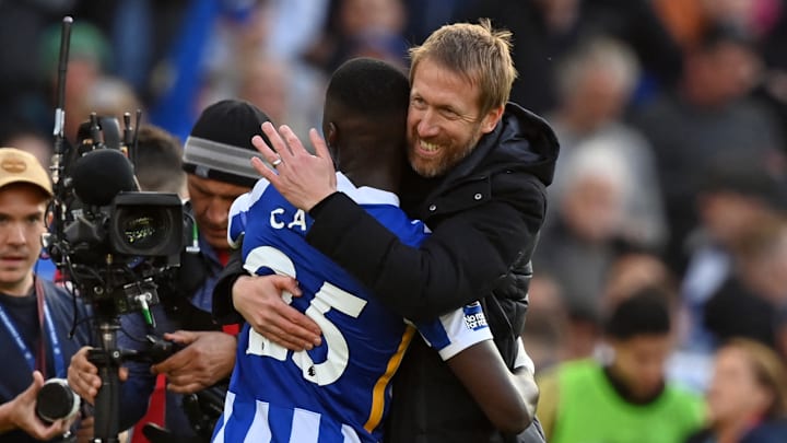 Graham Potter celebrates with Moises Caicedo while together at Brighton
