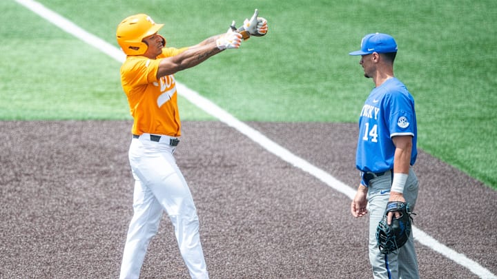 Tennessee infielder Christian Moore (1) gives a thumbs out to the Tennessee dugout during a college