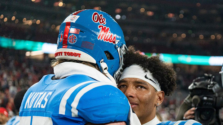 Ole Miss quarterback Trinidad Chambliss (6) cries and is hugged by offensive lineman Patrick Kutas (75) after losing the CFP Fiesta Bowl against Miami at the State Farm Stadium, in Glendale, Ariz., on Thursday, Jan. 8, 2026.