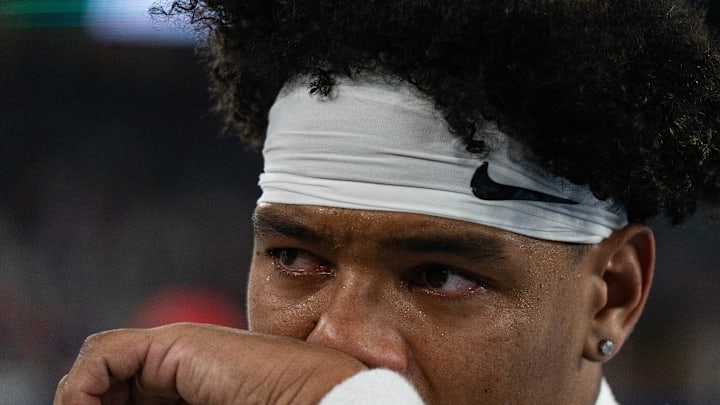 Ole Miss quarterback Trinidad Chambliss (6) cries after losing the CFP Fiesta Bowl against Miami at the State Farm Stadium, in Glendale, Ariz., on Thursday, Jan. 8, 2026.