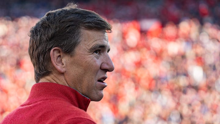Eli Manning stands on the sideline before the first round of the College Football Playoff against Tulane at Vaught-Hemingway Stadium in Oxford, Miss., on Saturday, Dec. 20, 2025. Eli Manning stands on the sideline before the first round of the College Football Playoff against Tulane at Vaught-Hemingway Stadium in Oxford, Miss., on Saturday, Dec. 20, 2025.