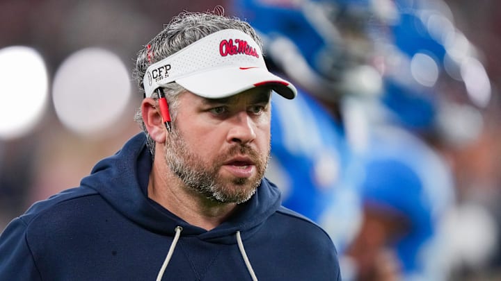 Ole Miss head coach Pete Golding runs off the field during warmups before the CFP Fiesta Bowl at the State Farm Stadium, in Glendale, Ariz., on Thursday, Jan. 8, 2026.