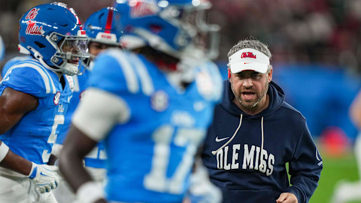 Ole Miss head coach Pete Golding runs off the field during warmups before the CFP Fiesta Bowl at the State Farm Stadium, in Glendale, Ariz., on Thursday, Jan. 8, 2026.