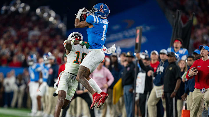 Ole Miss wide receiver De'Zhaun Stribling (1) catches the ball before being tackled by Miami Hurricanes defensive back Ja'boree Antoine (16) and dropping it during the CFP Fiesta Bowl at the State Farm Stadium, in Glendale, Ariz., on Thursday, Jan. 8, 2026.
