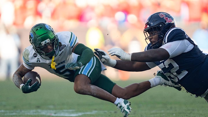 Ole Miss defensive tackle Will Echoles (52) tackles Tulane wide receiver A. Brown-Stephens (5) during the first round of the College Football Playoff at Vaught-Hemingway Stadium in Oxford, Miss., on Saturday, Dec. 20, 2025.