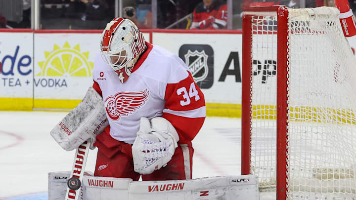Apr 16, 2025; Newark, New Jersey, USA; Detroit Red Wings goaltender Alex Lyon (34) makes a save against the New Jersey Devils during the second period at Prudential Center. Mandatory Credit: Ed Mulholland-Imagn Images