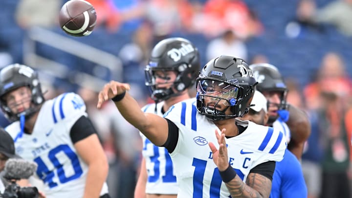Sep 27, 2025; Syracuse, New York, USA; Duke Blue Devils quarterback Darian Mensah (10) warms up before a game against the Syracuse Orange at the JMA Wireless Dome. Mandatory Credit: Mark Konezny-Imagn Images
