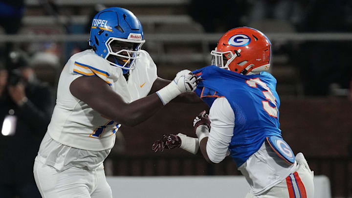 Tupelo's offensive lineman Antonio Berry (77) and Gulfport's defensive lineman Javon Anderson (3) go head-to-head during the MHSAA Class 7A state championship title game at Davis Wade Stadium, in Starkville, Miss., on Saturday, Dec. 6, 2025.