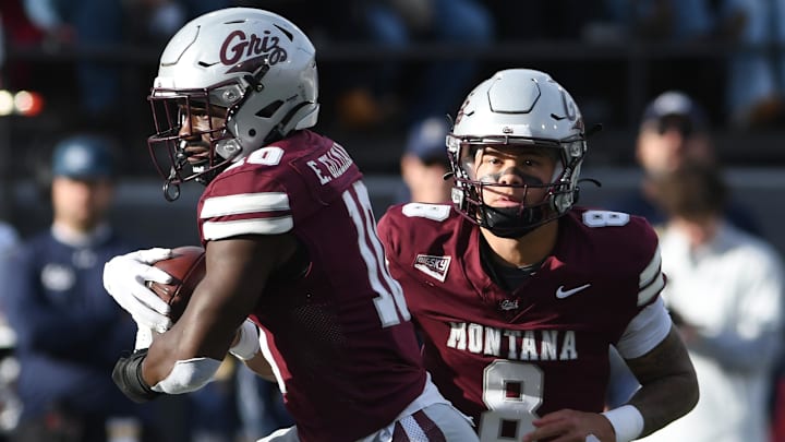 Montana running back Eli Gillman (10) receives the ball from quarterback Keali'I Ah Yat (8) during the first half against Montana State