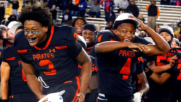 South Pittsburg's running back Ja'mychal Buckner (3) goes up to accept the MVP award as South Pittsburg's wide receiver Brandon Goldsmith (4) congratulates him after South Pittsburg beat McKenzie in the 2025 TSSAA Class 1A Football State Championship game on Friday, Dec. 5, 2025, at Finley Stadium in Chattanooga.