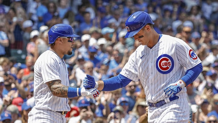 Jul 25, 2021; Chicago, Illinois, USA; Chicago Cubs first baseman Anthony Rizzo (44) celebrates with shortstop Javier Baez (9) after hitting a solo home run against the Arizona Diamondbacks during the first inning at Wrigley Field. Mandatory Credit: Kamil Krzaczynski-Imagn Images