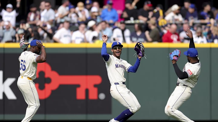 Seattle Mariners outfielders Randy Arozarena (56), Julio Rodriguez (44), and Victor Robles (10) celebrate after the team’s win against the Oakland Athletics at T-Mobile Park on March 30.