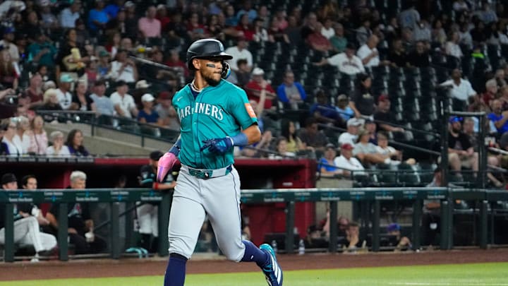 Seattle Mariners outfielder Julio Rodríguez scores during a game against the Arizona Diamondbacks on June 13 at Chase Field. Seattle Mariners outfielder Julio Rodríguez scores during a game against the Arizona Diamondbacks on June 13 at Chase Field.
