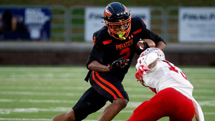 South Pittsburg's Dayon Cooper (2) carries the ball as McKenzie's Avery Brown (13) goes for a tackle during the 2025 TSSAA Class 1A Football State Championship game on Friday, Dec. 5, 2025, at Finley Stadium in Chattanooga. South Pittsburg's Dayon Cooper (2) carries the ball as McKenzie's Avery Brown (13) goes for a tackle during the 2025 TSSAA Class 1A Football State Championship game on Friday, Dec. 5, 2025, at Finley Stadium in Chattanooga.