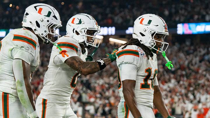 Miami Hurricanes wide receiver Keelan Marion (0) pats Malachi Toney (10) on the back after his touchdown during the CFP Fiesta Bowl at the State Farm Stadium, in Glendale, Ariz., on Thursday, Jan. 8, 2026. Miami Hurricanes wide receiver Keelan Marion (0) pats Malachi Toney (10) on the back after his touchdown during the CFP Fiesta Bowl at the State Farm Stadium, in Glendale, Ariz., on Thursday, Jan. 8, 2026.