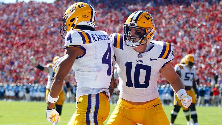 Sep 27, 2025; Oxford, Mississippi, USA; LSU Tigers tight end Bauer Sharp (10) reacts with LSU Tigers wide receiver Nic Anderson (4) after a touchdown catch during the first quarter against the Mississippi Rebels at Vaught-Hemingway Stadium. Mandatory Credit: Petre Thomas-Imagn Images Sep 27, 2025; Oxford, Mississippi, USA; LSU Tigers tight end Bauer Sharp (10) reacts with LSU Tigers wide receiver Nic Anderson (4) after a touchdown catch during the first quarter against the Mississippi Rebels at Vaught-Hemingway Stadium. Mandatory Credit: Petre Thomas-Imagn Images