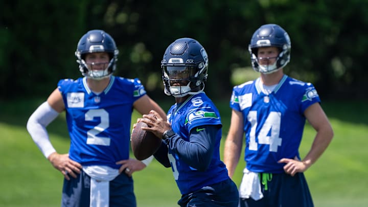 Jun 11, 2025; Renton, WA, USA; Seattle Seahawks quarterback Jalen Milroe (6) looks to pass as quarterback Drew Lock (2) and quarterback Sam Darnold (14) during mini-camp at Virginia Mason Athletic Center. Jun 11, 2025; Renton, WA, USA; Seattle Seahawks quarterback Jalen Milroe (6) looks to pass as quarterback Drew Lock (2) and quarterback Sam Darnold (14) during mini-camp at Virginia Mason Athletic Center.