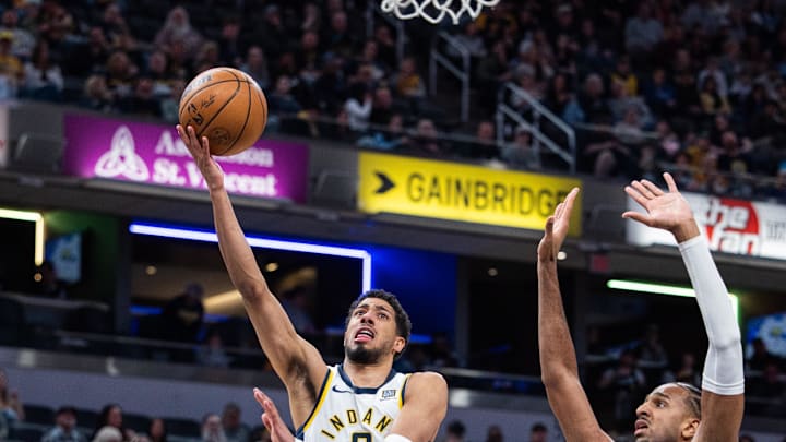 Apr 8, 2025; Indianapolis, Indiana, USA; Indiana Pacers guard Tyrese Haliburton (0) shoots the ball while Washington Wizards guard Jordan Poole (13) defends in the first half at Gainbridge Fieldhouse. Mandatory Credit: Trevor Ruszkowski-Imagn Images Apr 8, 2025; Indianapolis, Indiana, USA; Indiana Pacers guard Tyrese Haliburton (0) shoots the ball while Washington Wizards guard Jordan Poole (13) defends in the first half at Gainbridge Fieldhouse. Mandatory Credit: Trevor Ruszkowski-Imagn Images