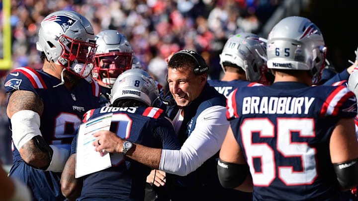 New England Patriots wide receiver Stefon Diggs (8) celebrates scoring a touchdown with  head coach Mike Vrabel.