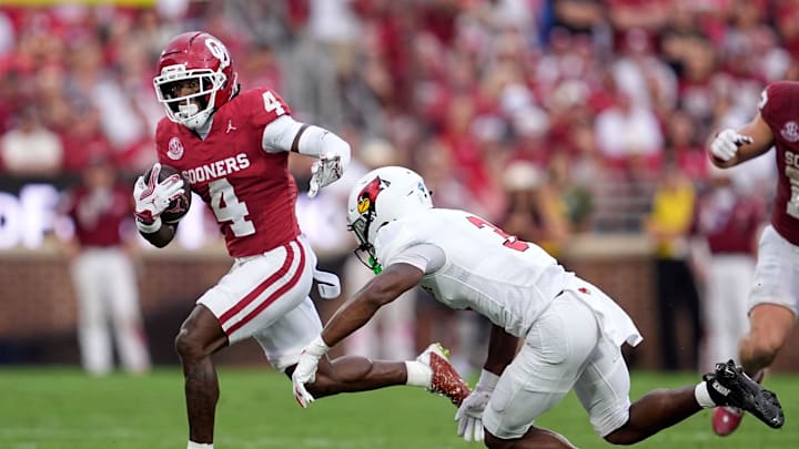 Oklahoma's Deion Burks (4) gets by Illinois State's Jordan Coleman (3) in the first half of the college football game between the University of Oklahoma Sooners and the Illinois State Redbirds at the Gaylord Family Ð Oklahoma Memorial Stadium in Norman, Okla., Saturday, Aug. 30, 2025.