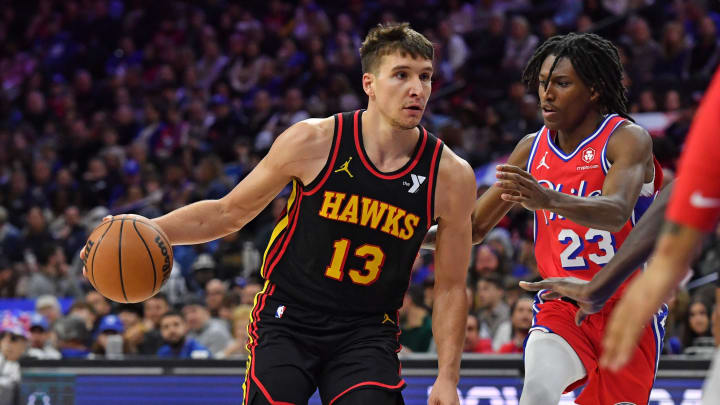 Feb 9, 2024; Philadelphia, Pennsylvania, USA; Atlanta Hawks guard Bogdan Bogdanovic (13) drives to the basket against Philadelphia 76ers guard Terquavion Smith (23) during the second quarter at Wells Fargo Center. Mandatory Credit: Eric Hartline-USA TODAY Sports