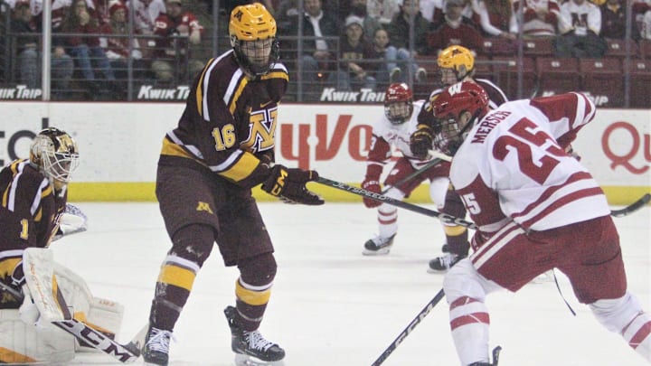 Wisconsin's Dominick Mersch (25) can't get a shot past Minnesota's Colin Schmidt (16) and Justen Close (1) during the teams' hockey game at the Kohl Center in Madison, Wis. on Friday Feb. 10, 2023. Minnesota won, 4-1.

Uwice Minnesota 1 Feb 9 2023