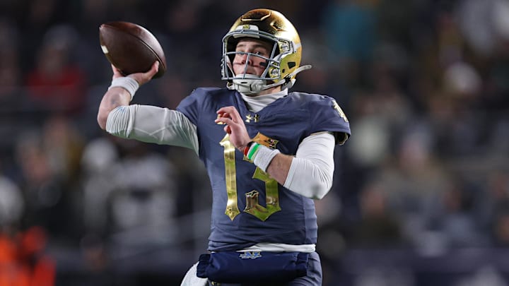 Nov 23, 2024; New York, New York, USA; Notre Dame Fighting Irish quarterback Riley Leonard (13) throws the ball during the first half against the Army Black Knights at Yankee Stadium. Mandatory Credit: Vincent Carchietta-Imagn Images Nov 23, 2024; New York, New York, USA; Notre Dame Fighting Irish quarterback Riley Leonard (13) throws the ball during the first half against the Army Black Knights at Yankee Stadium. Mandatory Credit: Vincent Carchietta-Imagn Images