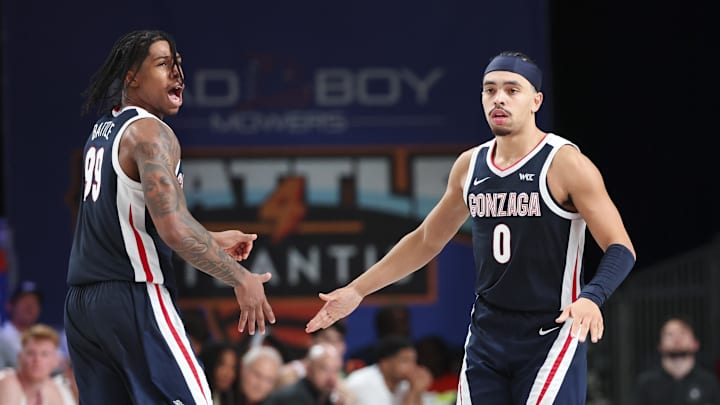 Nov 28, 2024; Paradise Island, Bahamas, BHS;  Gonzaga Bulldogs guard Khalif Battle (99) celebrates with Gonzaga Bulldogs guard Ryan Nembhard (0) during the second half against the Indiana Hoosiers at Imperial Arena at the Atlantis resort. Mandatory Credit: Kevin Jairaj-Imagn Images