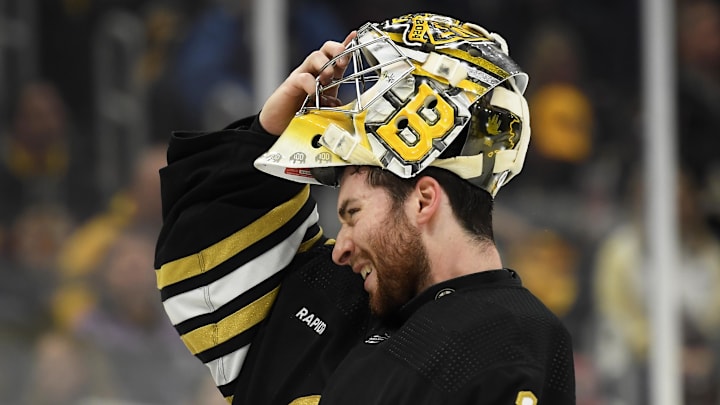 May 12, 2024; Boston, Massachusetts, USA; Boston Bruins goaltender Jeremy Swayman (1) slips on his mask during the second period in game four of the second round of the 2024 Stanley Cup Playoffs against the Florida Panthers at TD Garden. Mandatory Credit: Bob DeChiara-Imagn Images
