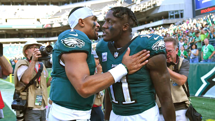 Philadelphia Eagles quarterback Jalen Hurts (1) and wide receiver A.J. Brown (11) celebrate win against the Washington Commanders at Lincoln Financial Field. Philadelphia Eagles quarterback Jalen Hurts (1) and wide receiver A.J. Brown (11) celebrate win against the Washington Commanders at Lincoln Financial Field.