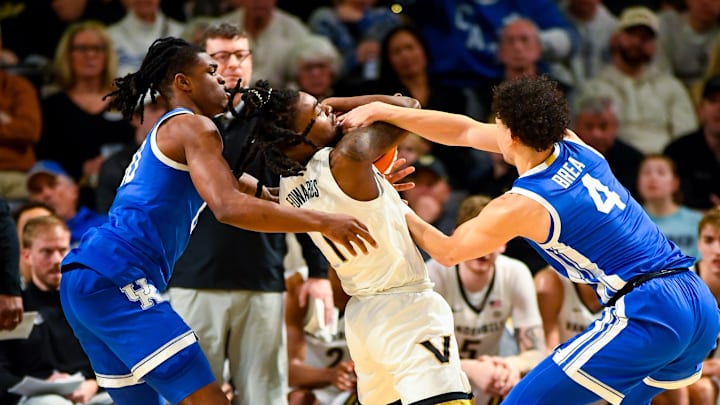 Jan 25, 2025; Nashville, Tennessee, USA;  Kentucky Wildcats guard Koby Brea (4) traps Vanderbilt Commodores guard Jason Edwards (1) and get a jump ball called during the second half at Memorial Gymnasium. Mandatory Credit: Steve Roberts-Imagn Images