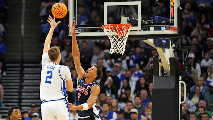 Mar 27, 2025; Newark, NJ, USA; Duke Blue Devils forward Cooper Flagg (2) shoots the ball against Arizona Wildcats forward Carter Bryant (9) during the first half during an East Regional semifinal of the 2025 NCAA tournament at Prudential Center. Mandatory Credit: Robert Deutsch-Imagn Images