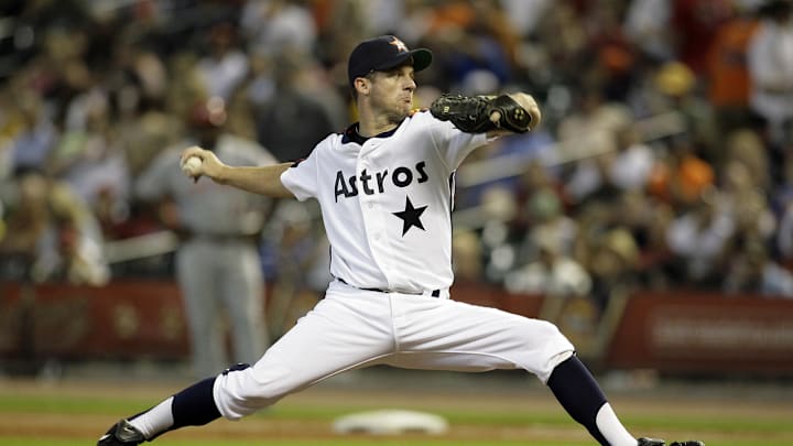 July 24, 2010; Houston, TX, USA; Houston Astros starting pitcher Roy Oswalt (44) throws a pitch against the Cincinnati Reds in the first inning at Minute Maid Park. The Reds defeated the Astros 7-0. 