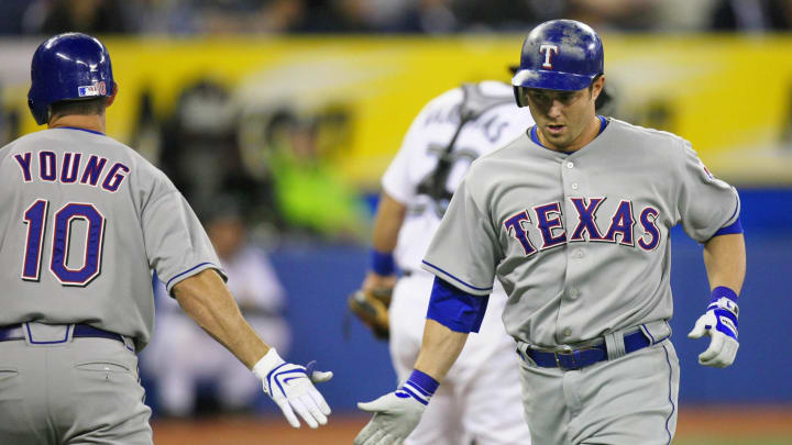 Apr 16, 2008; Toronto, ON, Canada; Texas Rangers left fielder Frank Catalanotto (27) is congratulated by shortstop Michael Young (10) after hitting a home run in the 8th inning against the Toronto Blue Jays at the Rogers Centre in Toronto, ON. The Rangers beat the Blue Jays 7-5 in 14 innings. Mandatory Credit: Tom Szczerbowski-USA TODAY Sports