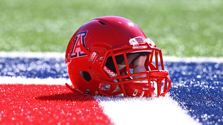Nov 28, 2014; Tucson, AZ, USA; Detailed view of an Arizona Wildcats helmet on the field against the Arizona State Sun Devils during the 88th annual territorial cup at Arizona Stadium. The Wildcats defeated the Sun Devils 42-35 to win the Pac-12 south title. Mandatory Credit: Mark J. Rebilas-Imagn Images Nov 28, 2014; Tucson, AZ, USA; Detailed view of an Arizona Wildcats helmet on the field against the Arizona State Sun Devils during the 88th annual territorial cup at Arizona Stadium. The Wildcats defeated the Sun Devils 42-35 to win the Pac-12 south title. Mandatory Credit: Mark J. Rebilas-Imagn Images