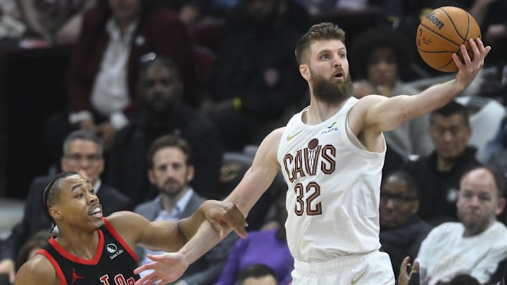 Apr 29, 2026; Cleveland, Ohio, USA; Cleveland Cavaliers forward Dean Wade (32) rebounds beside Toronto Raptors forward Scottie Barnes (4) in the third quarter of game five of the first round of the 2026 NBA Playoffs at Rocket Arena. Mandatory Credit: David Richard-Imagn Images