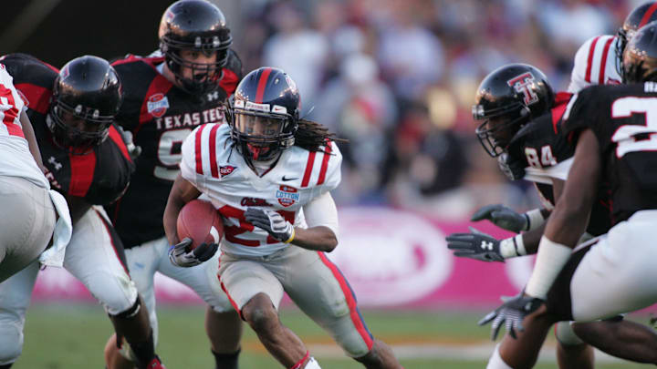 Jan 02, 2009; Dallas, TX, USA;  Mississippi Rebels running back Dexter McCluster (22) rushes against the Texas Tech Red Raiders during the 2009 Cotton Bowl Classic at the Cotton Bowl. Mississippi won 47-34. Mandatory Credit: Tim Heitman-Imagn Images