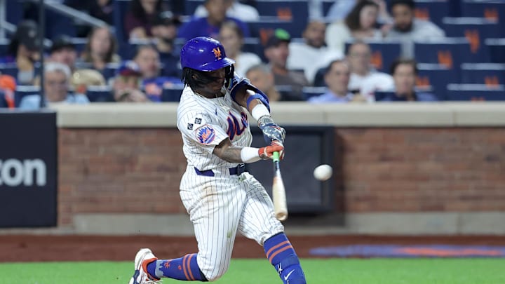 Sep 17, 2024; New York City, New York, USA; New York Mets shortstop Luisangel Acuna (2) hits a solo home run against the Washington Nationals during the eighth inning at Citi Field. The home run was the first of his major league career. Mandatory Credit: Brad Penner-Imagn Images