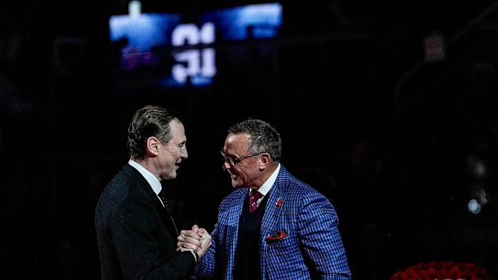 Sergei Fedorov shakes hands with Steve Yzerman during his jersey retirement ceremony at Little Caesars Arena in Detroit on Monday, Jan. 12, 2026.